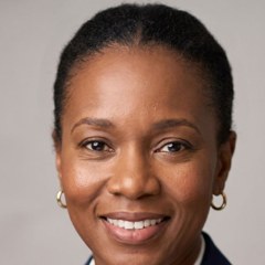 A smiling office manager in a navy blazer (Illustration)